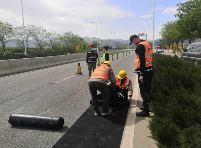 Durable tape for fast repair of asphalt cracks and pavement damage